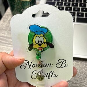 Green and Blue Cartoon Character Badge Reel